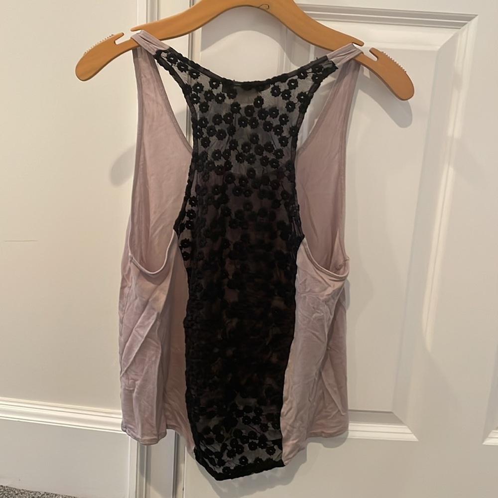 Wearing kleinberg purple and black racerback tank top. Lace strip down back XS